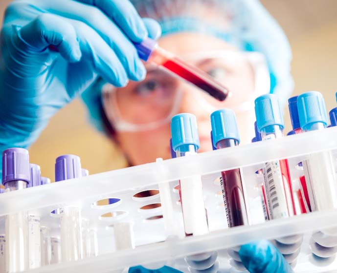 Medical professional sampling a blood