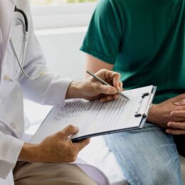 Doctor writing medical diagnosis