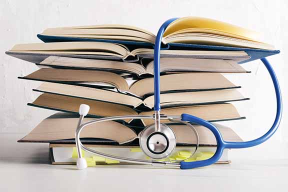 Stack of books with stethoscope