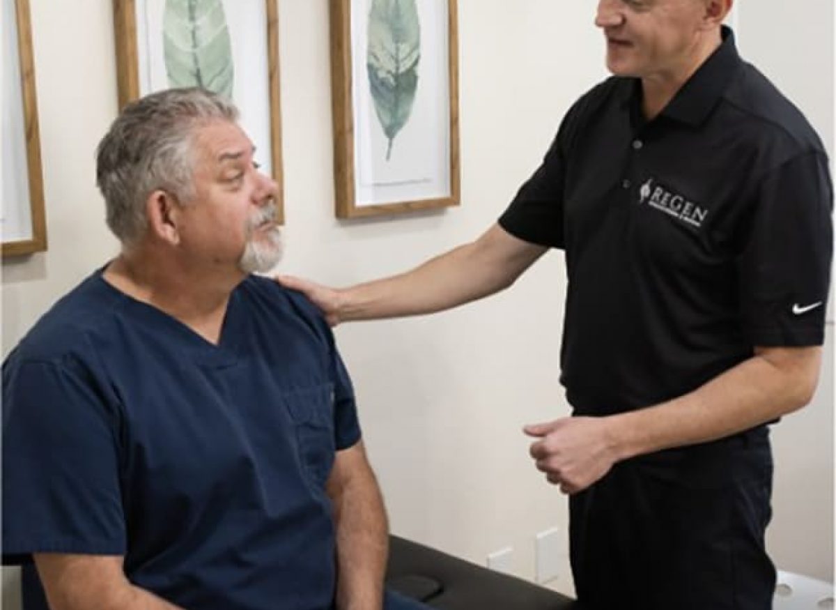 Brian Gallagher explaining to patient